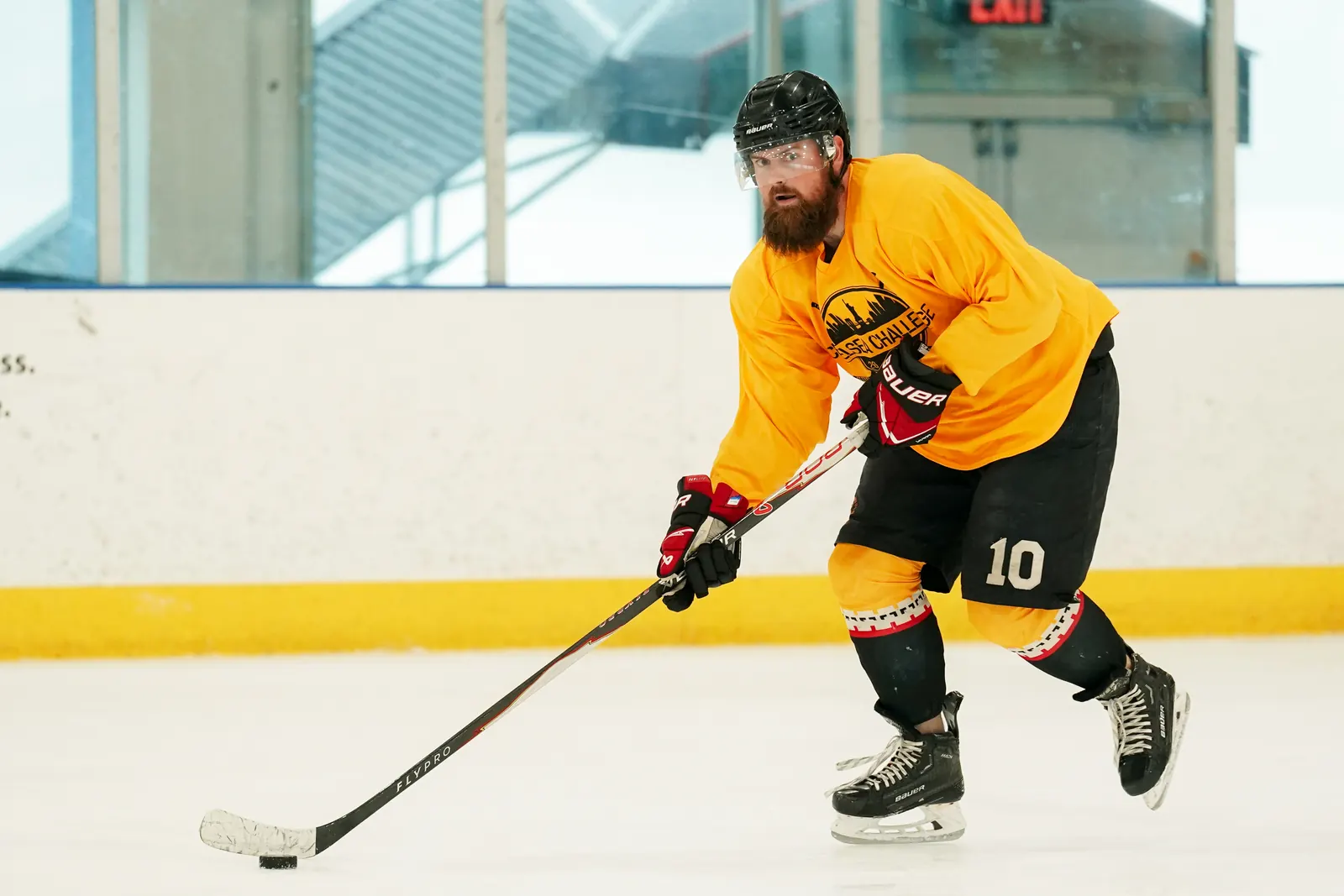 Whale Tailers player number 10 skates with the puck