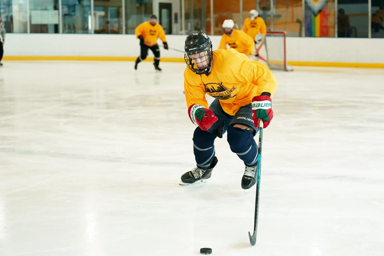 Whale Tailers skater carries the puck through the neutral zone