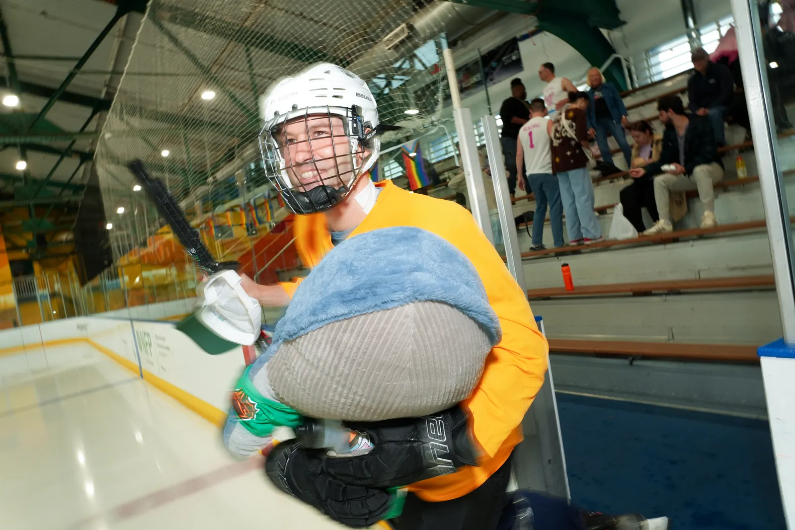A Whale Tailers player skates past the bench holding Boris