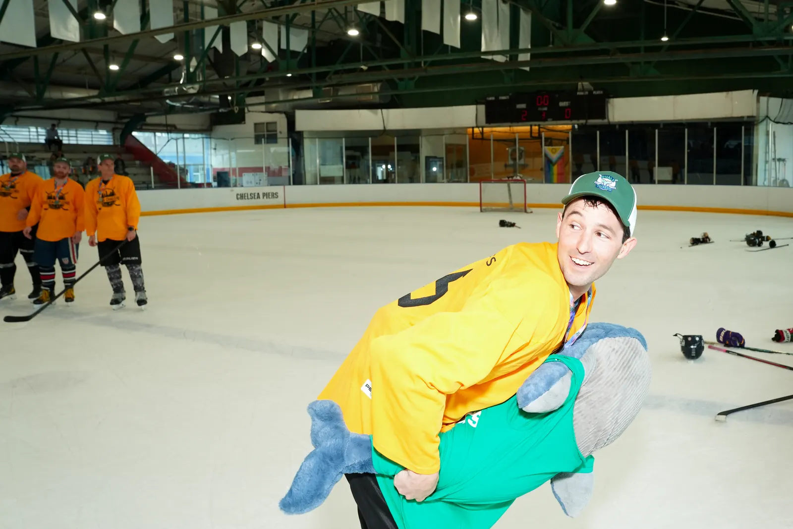 A Whale Tailers player celebrates on the ice with Boris